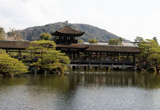 The covered Taiheikaku bridge across the pond in the Heian Shrine garden