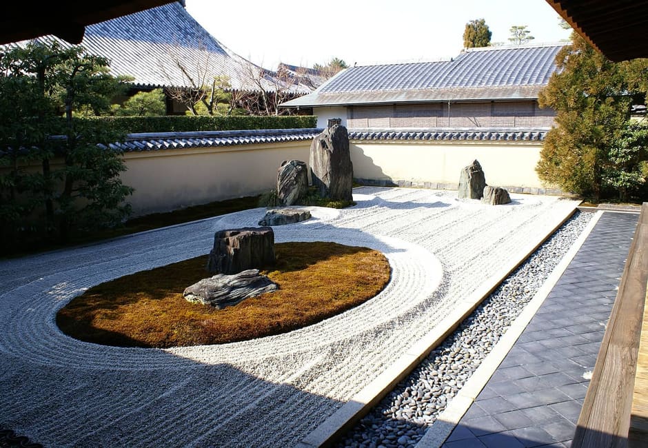 A raked gravel garden with a moss island at Ryogen-in, a subtemple of Daitoku-ji