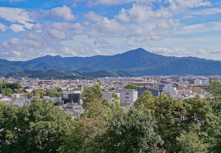 Mount Hiei rising beyond the rooftops of northern Kyoto, seen from the top of Funaokayama