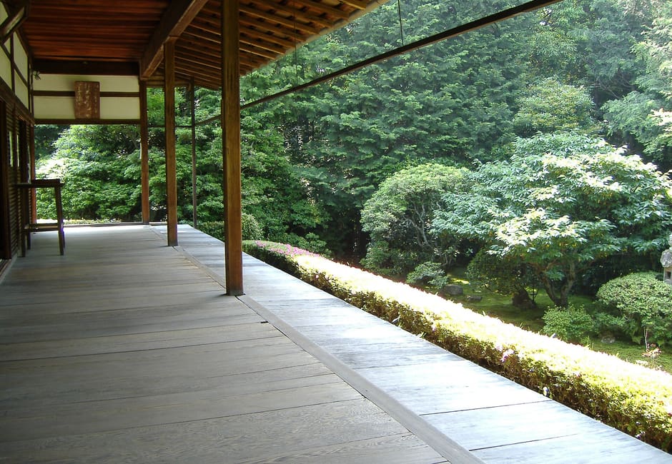 The veranda at Keishun-in in Myoshin-ji, looking onto a moss garden with clipped azalea hedges and maples