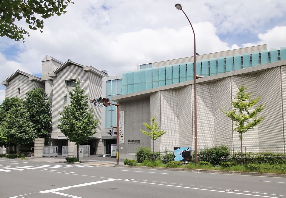 The Kyoto University Museum building on Higashioji-dori, stone walls below a green glass upper floor
