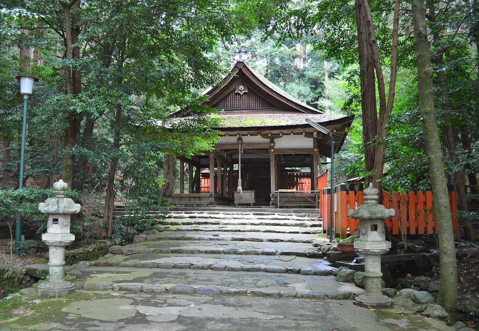 Stone steps and lanterns leading up to the worship hall of Ota Shrine in Kamigamo