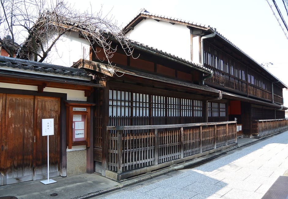 The wooden lattice facade and entrance of Sumiya, the old ageya banquet house in Shimabara