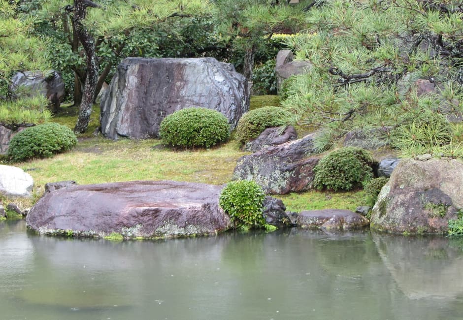 The pond, rocks and pines of Shosei-en garden near Kyoto Station